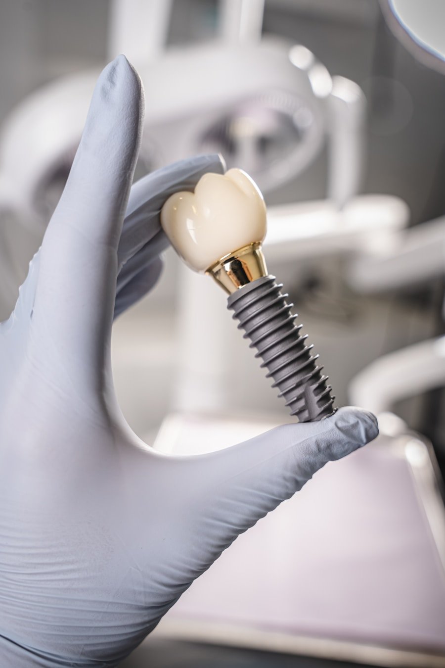 Dental crown and implant held by a dentist in gloves